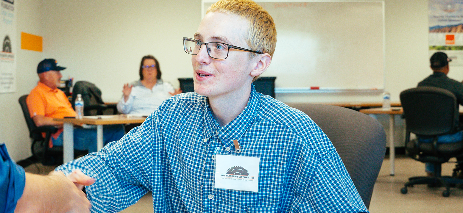 A man shaking a hand after an interview