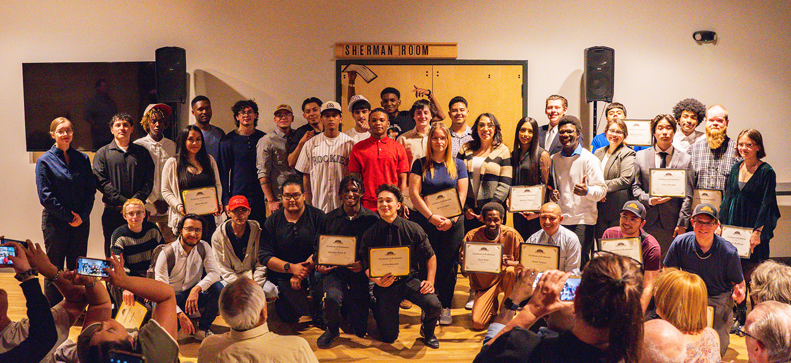 Master's Apprentice graduates standing with their certifications