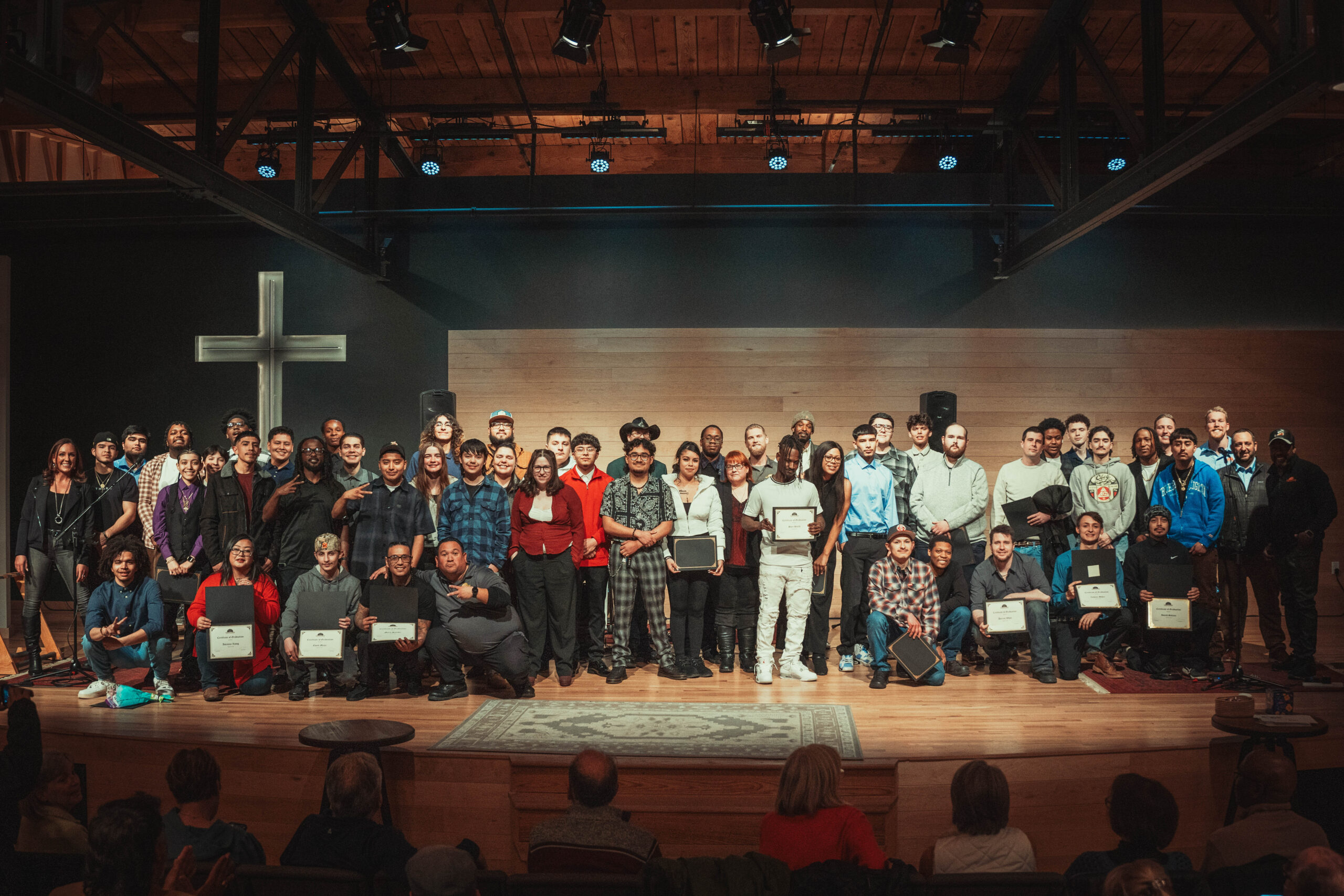 Master's Apprentice graduates standing with their certifications