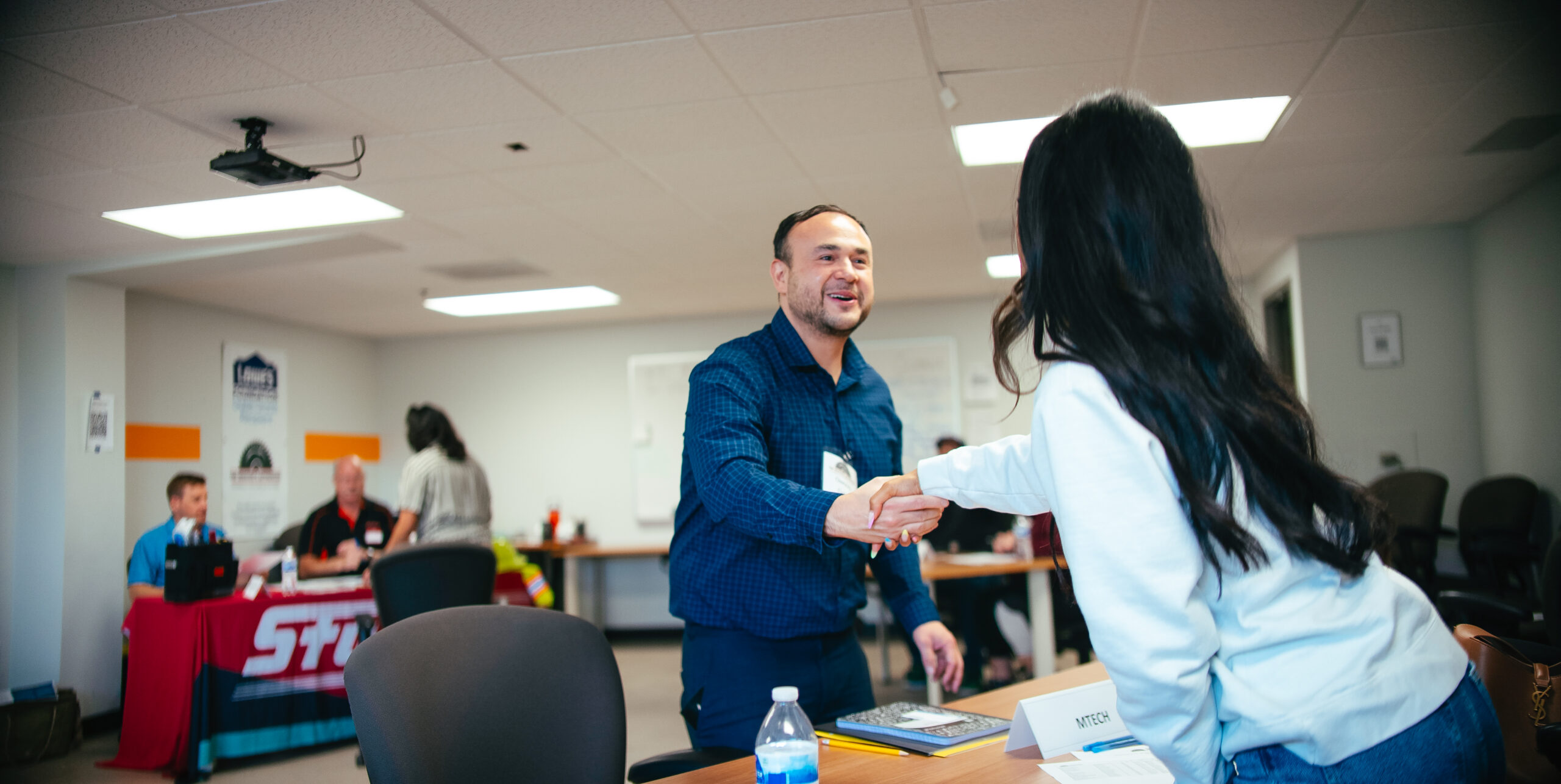 A man shaking a hand after an interview